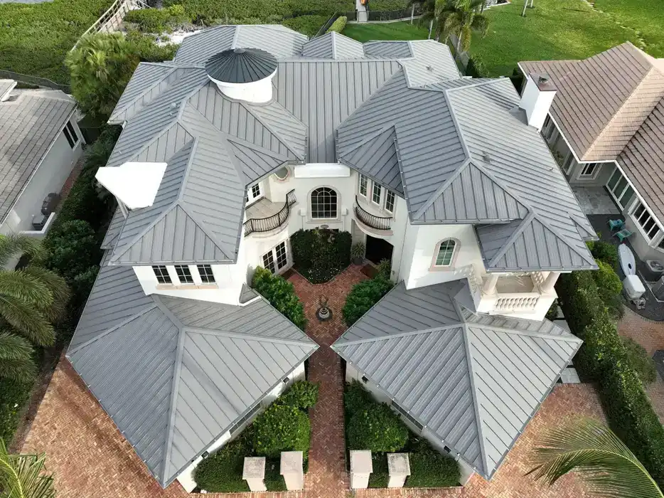 Aerial view of a large Jupiter home with a finished gray metal roof